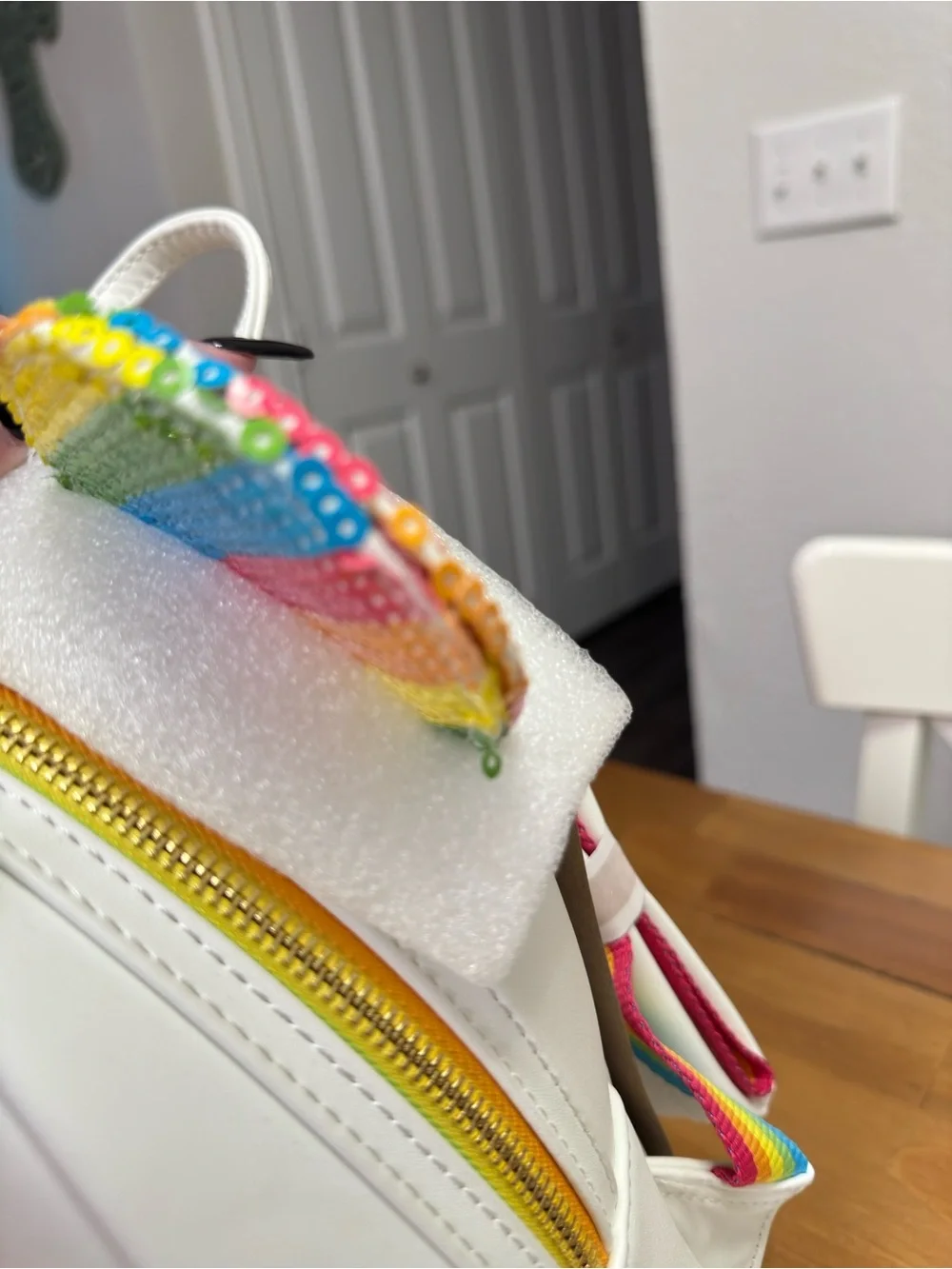 Loungefly White Mini Backpack with Rainbow Sequin Ears and Bow